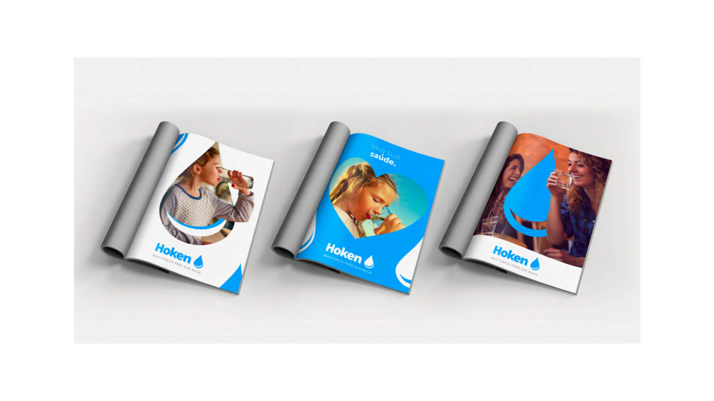 Three Hoken brochures with blue water-drop branding, shown open on a light surface.